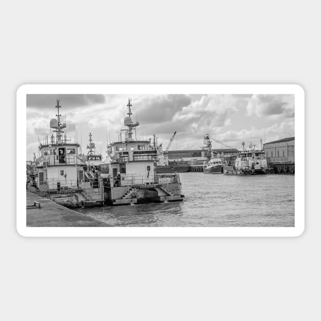 Crew transfer vessels moored up in the docks in the seaside town of Great Yarmouth, Norfolk Sticker by yackers1